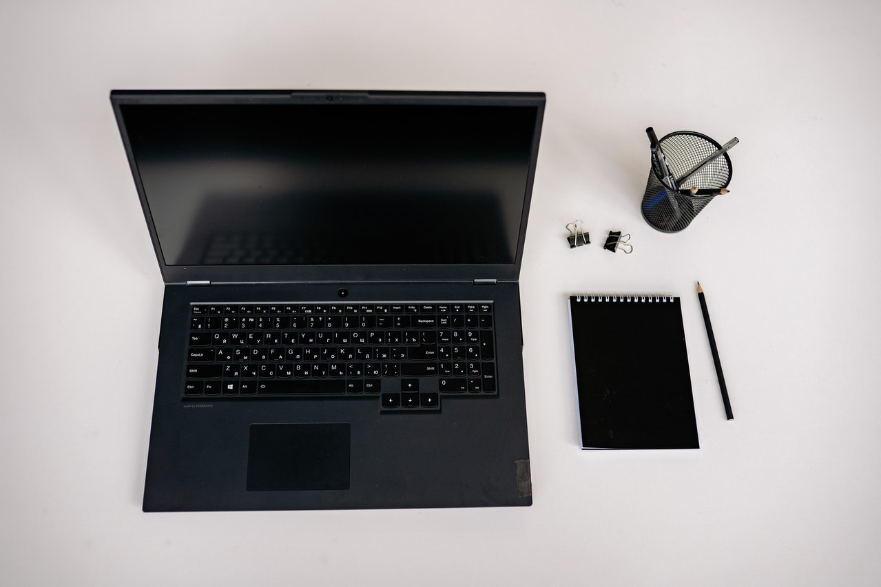 Black laptop on a desk ready to be used