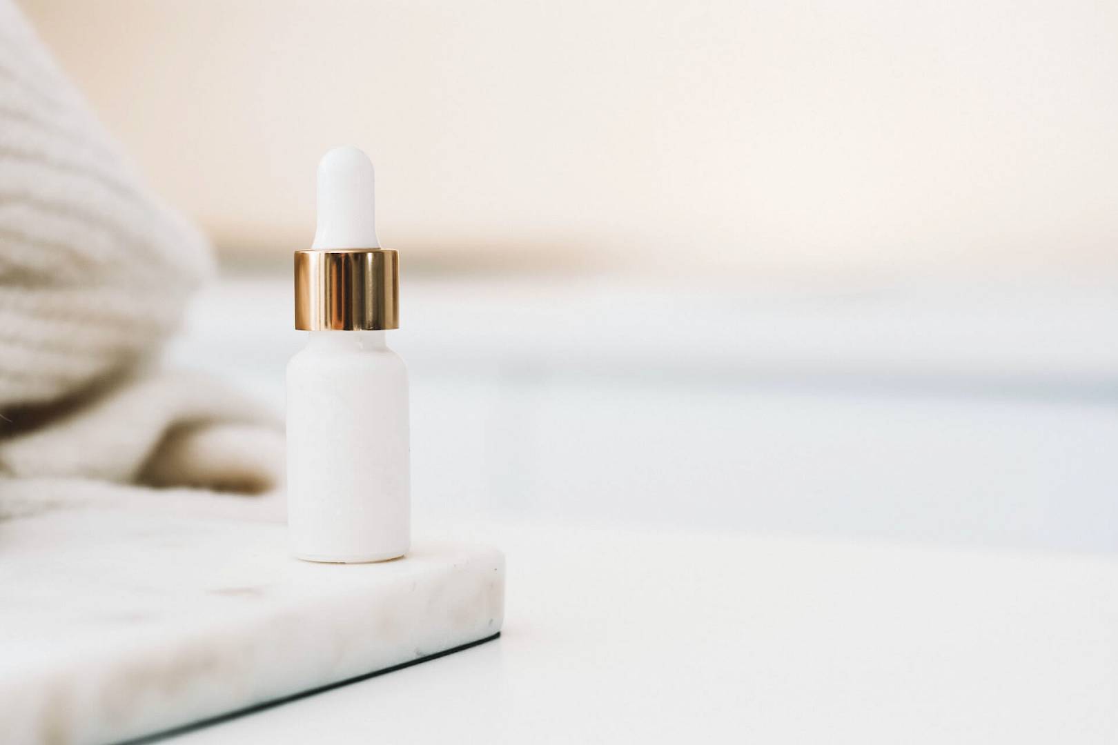 One bottle of cosmetic's on the table in the bathroom