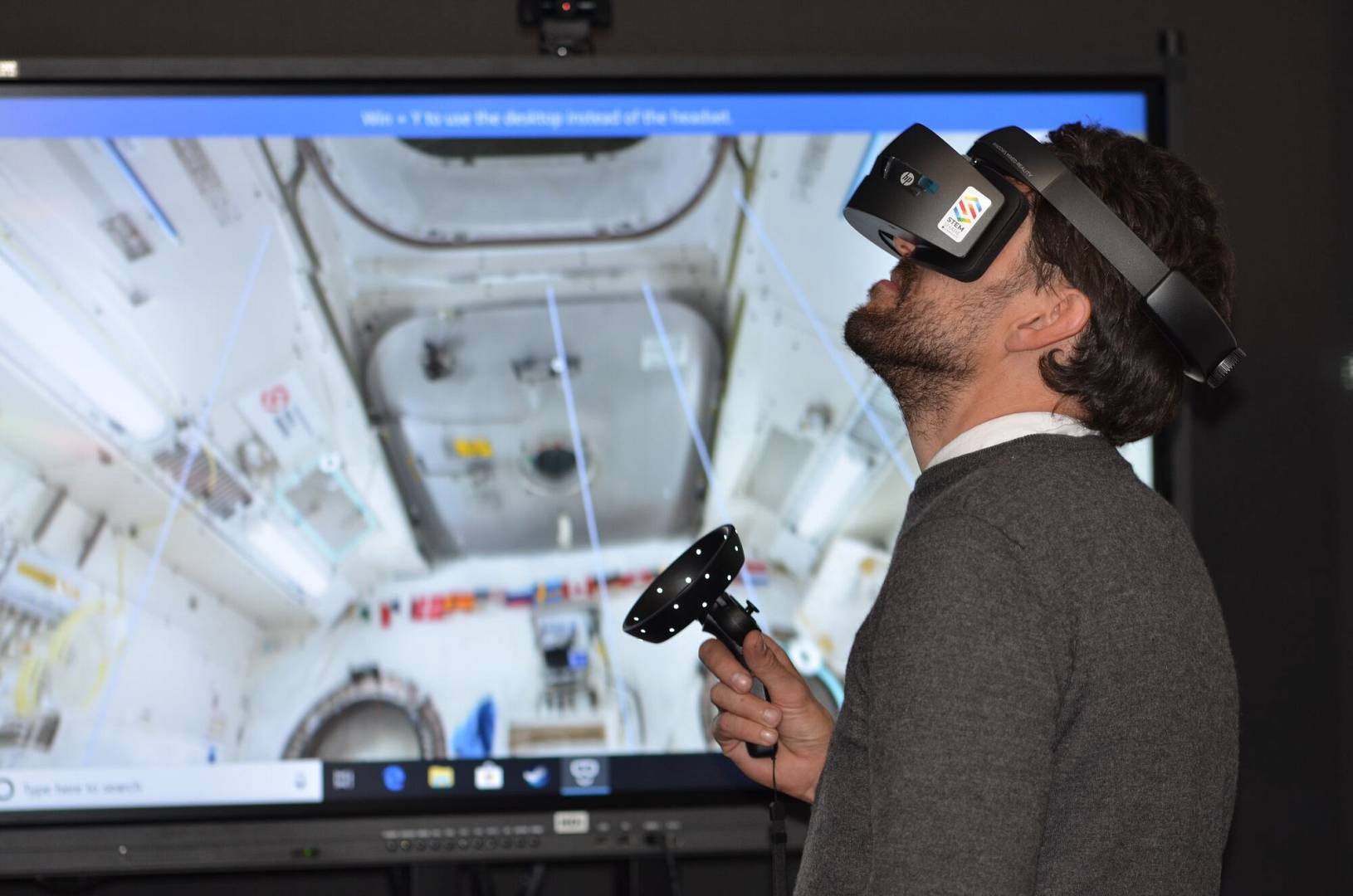 Man is using VR glasses to play a game